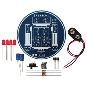 Blinky Robot Kit parts with round circuit board, red LEDs, capacitors, resistors, switch and 9-volt battery clip
