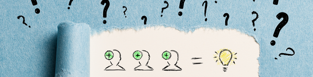 Three person icons with plus signs equal a glowing light bulb, drawn on paper torn from blue with question marks