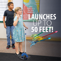 Children with Pitsco Education's STEM straw rocket launcher in a classroom setting, text 'Launches up to 50 feet!' displayed.