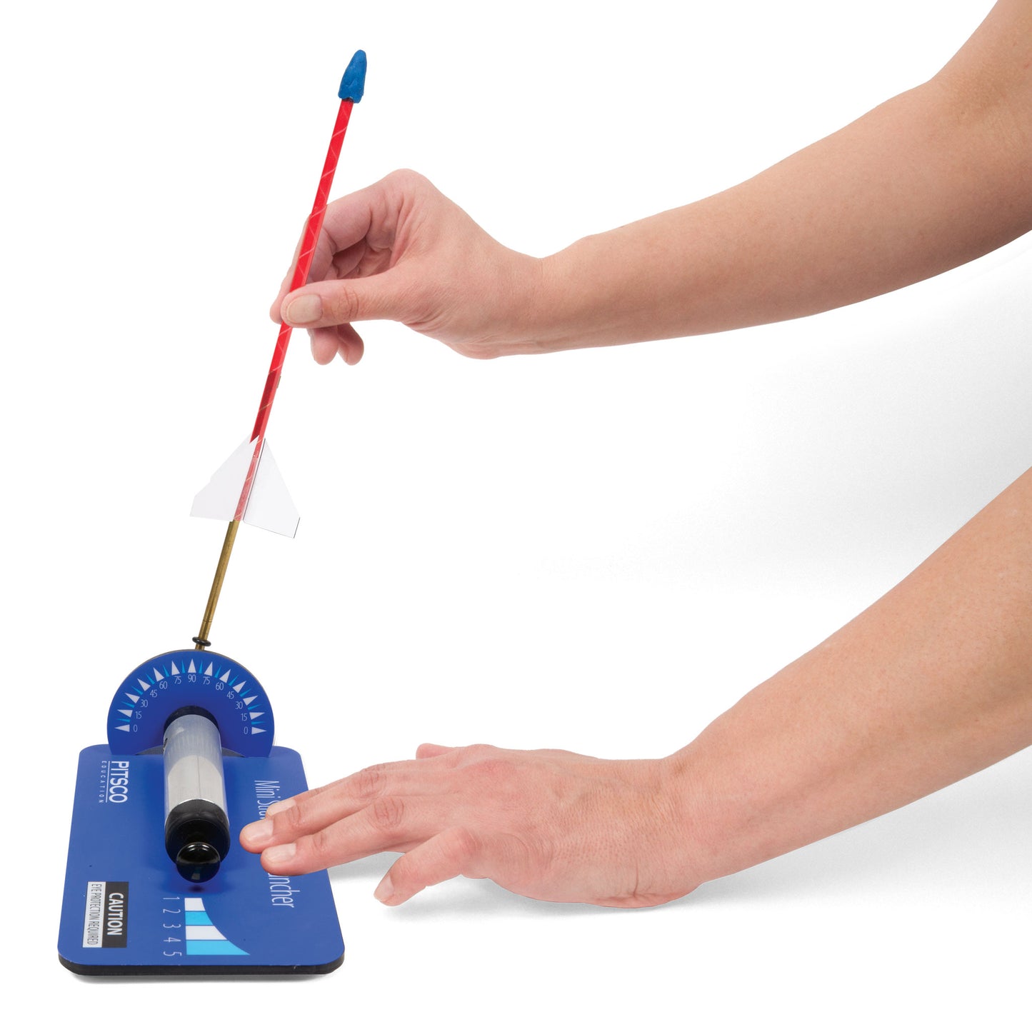 Hand loading a straw rocket onto the blue mini straw rocket launcher
