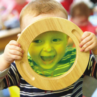Student using wooden color mixing viewers, a hands-on STEM activity kit for early childhood exploration and PreK-2 classroom STEM learning