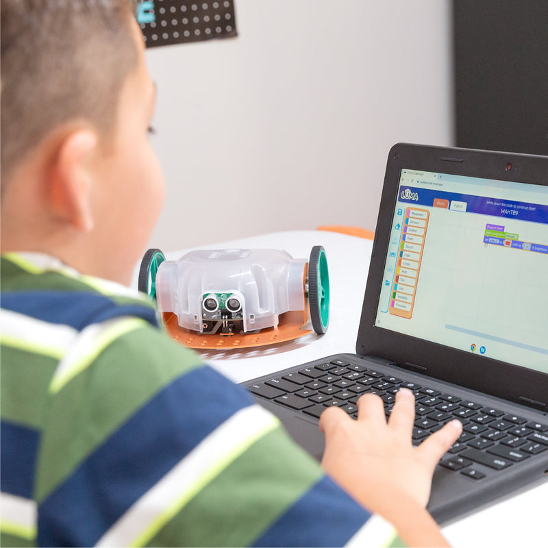 4th 5th or 6th grade student engaged in coding with Luma from Pitsco Education.
