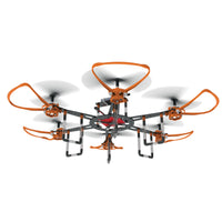 Infinity drone with orange and black arms and spinning propellers