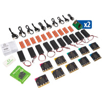 Collection of electronic components including micro:bit boards, batteries, and cables